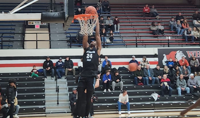 Darryn Peterson of Huntington Prep dunks in warmups before a game against Richmond Heights on February 17, 2024